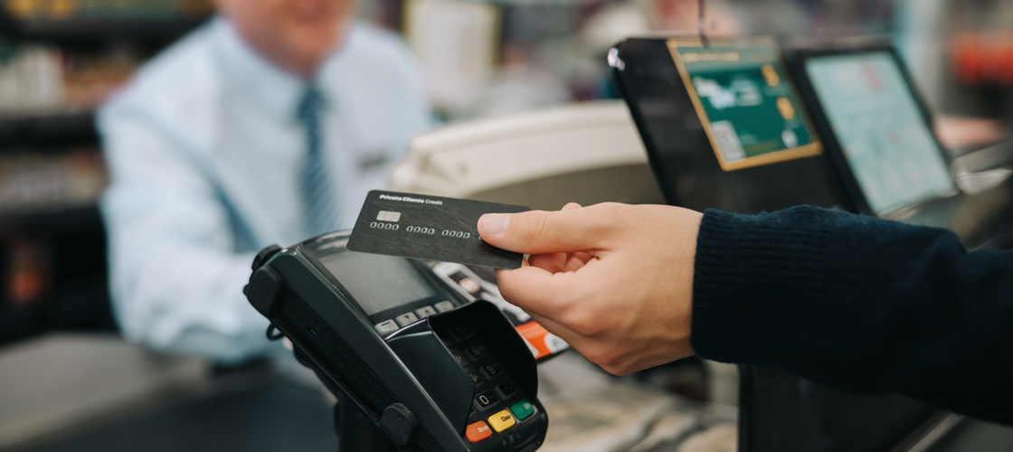 Person tapping a credit card to complete a transaction